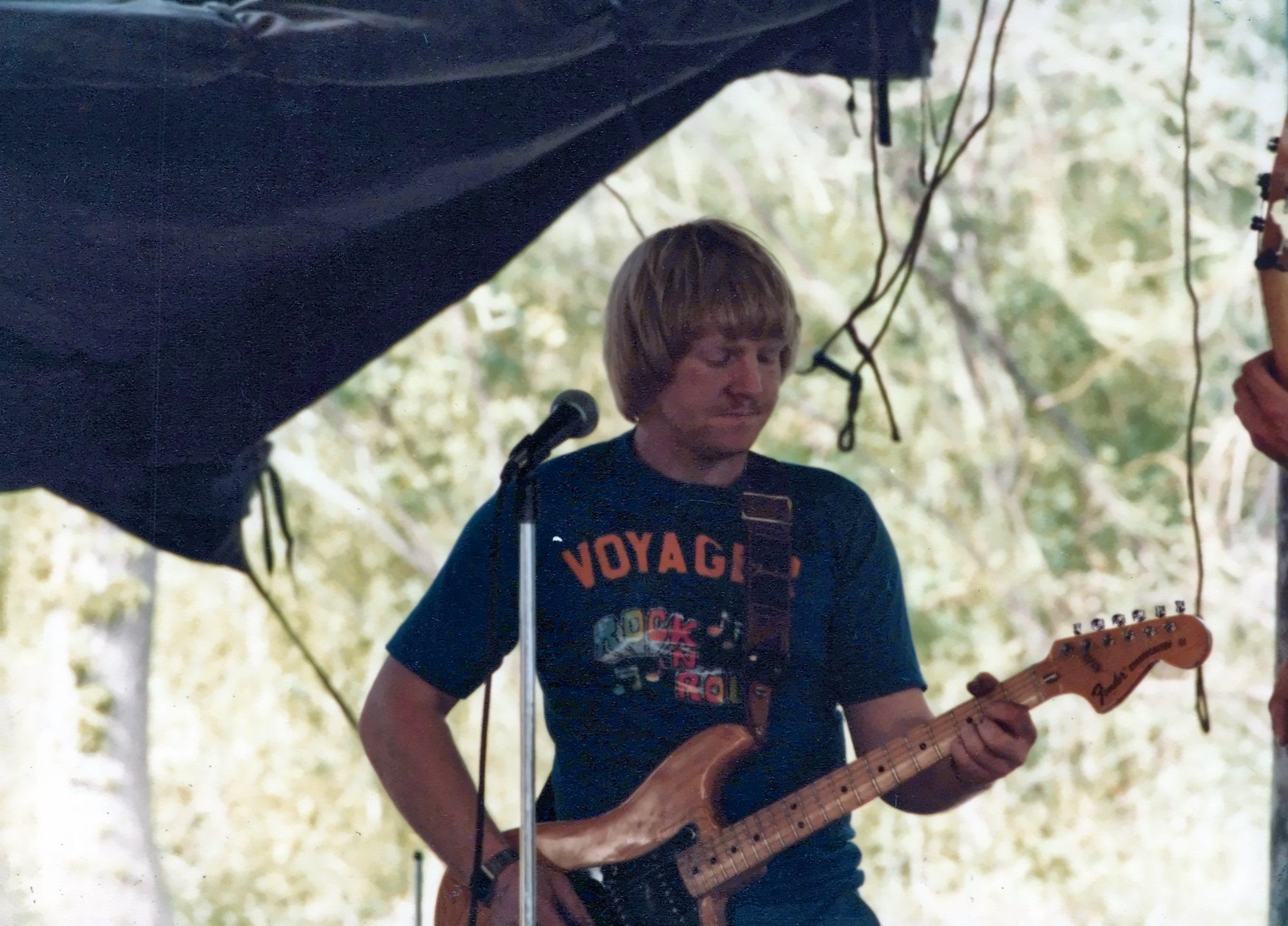 Ted on stage, playing guitar